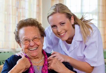 Two carers laughing together