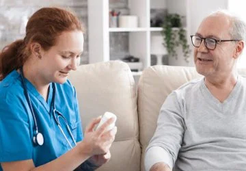A carer supporting a service user at home
